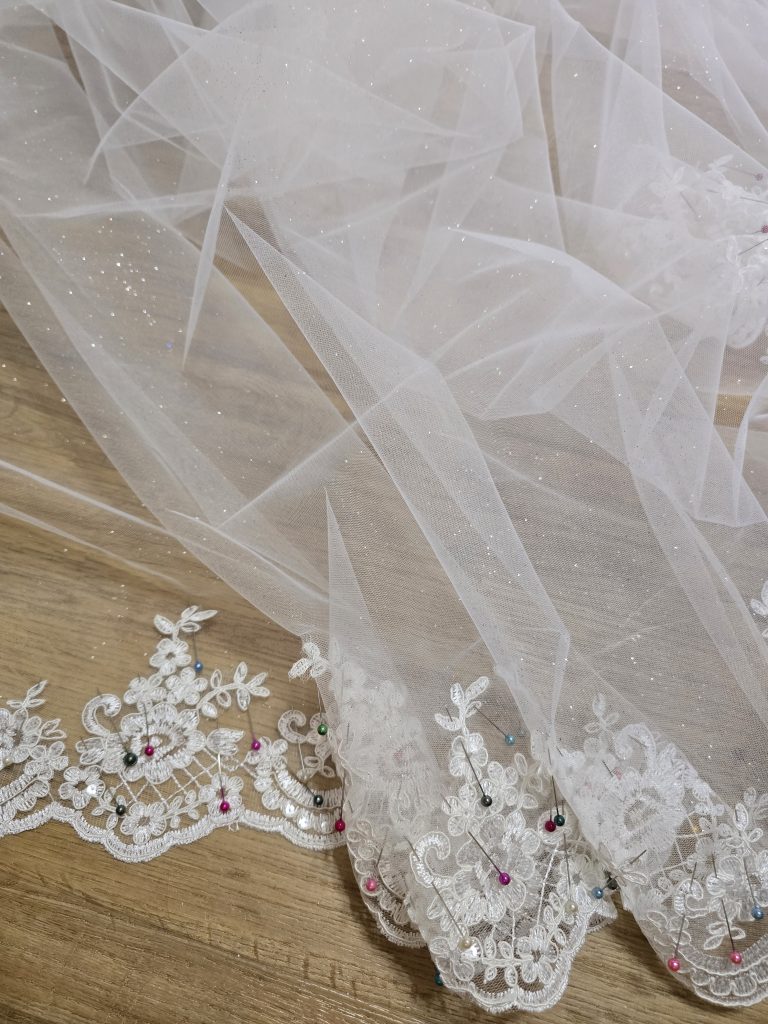 K GOWN - HAND-SEWING LACE TO WEDDING VEIL